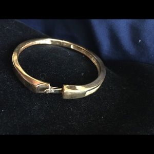 Gold tone bracelet with accents